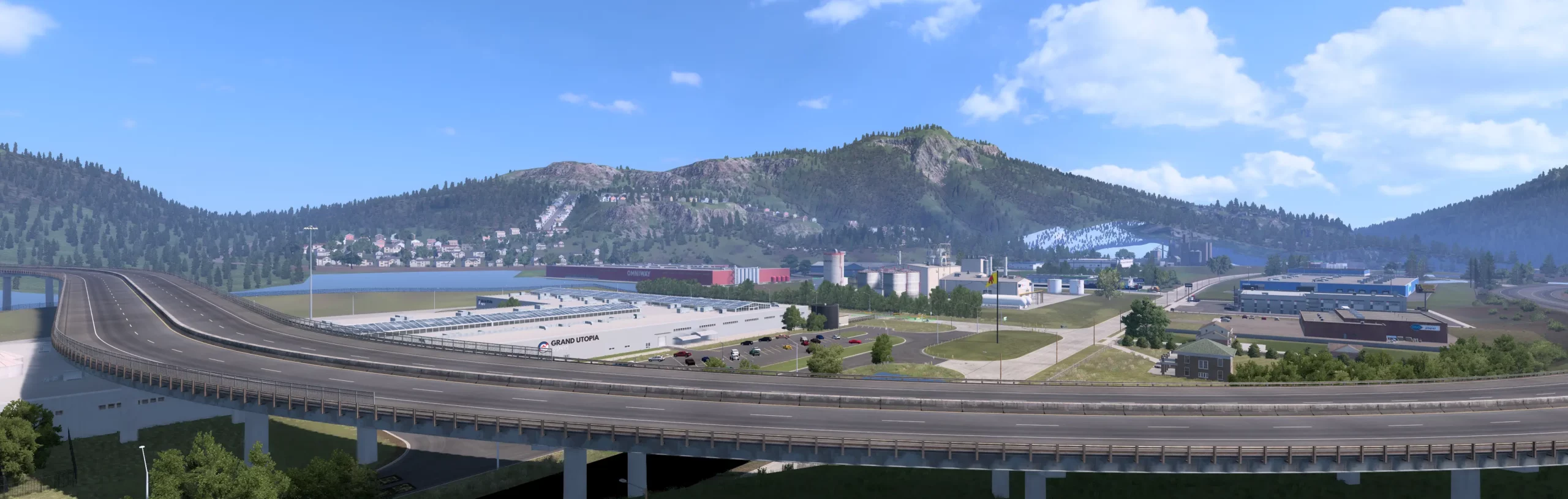 Zone industrielle de Grand Utopia of America avec autoroutes, entreprises et relief montagneux.